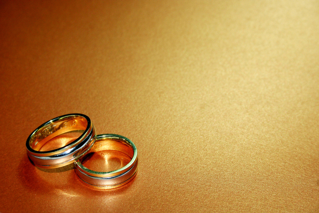 wedding rings on a smooth wooden table